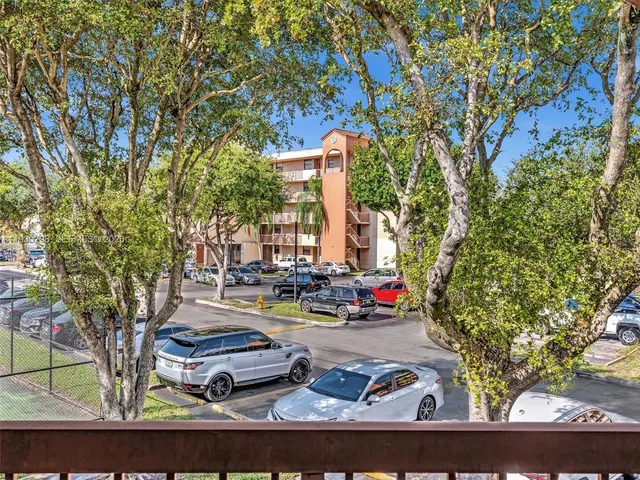 a view of a street with cars park