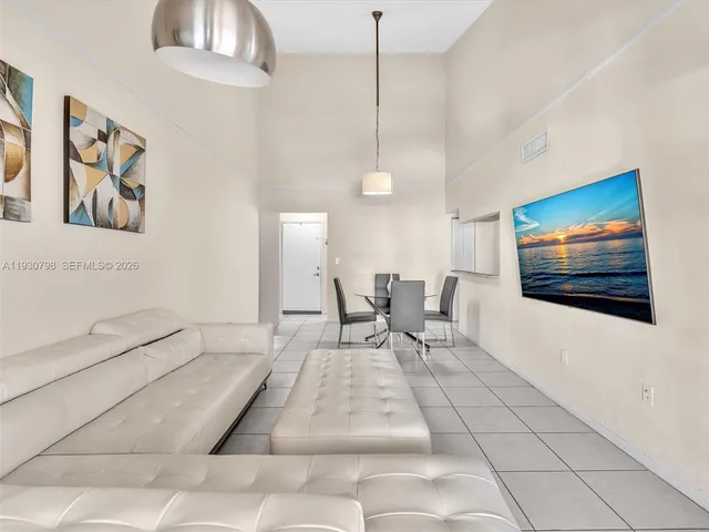 a bathroom with a granite countertop shower and a sink