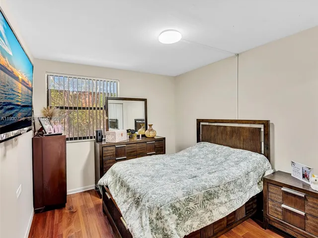 a balcony with outdoor seating and wooden floor