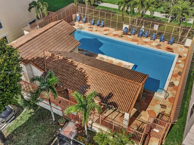 a aerial view of a house with garden space and street view