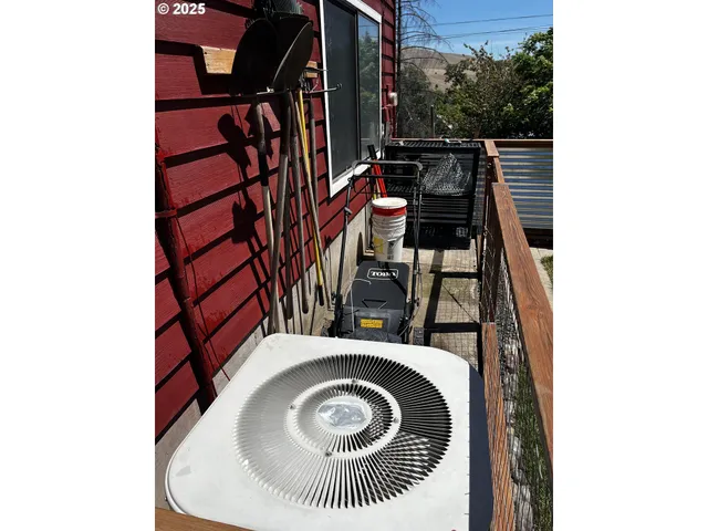 a view of a bird sitting on a wall