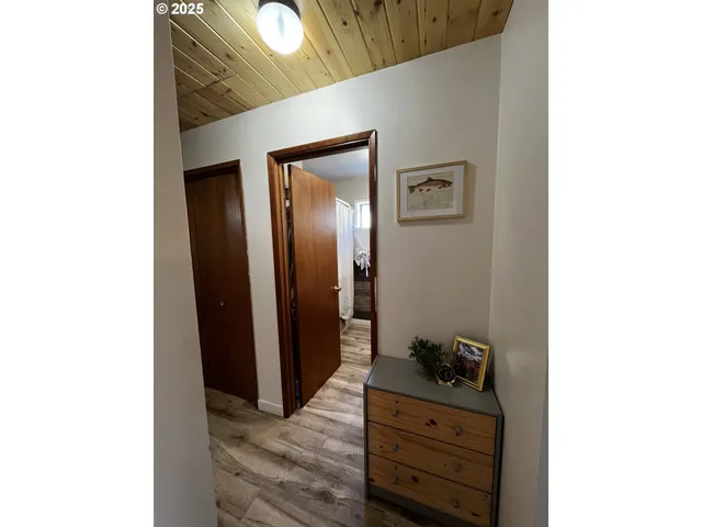 a view of a hallway with front door