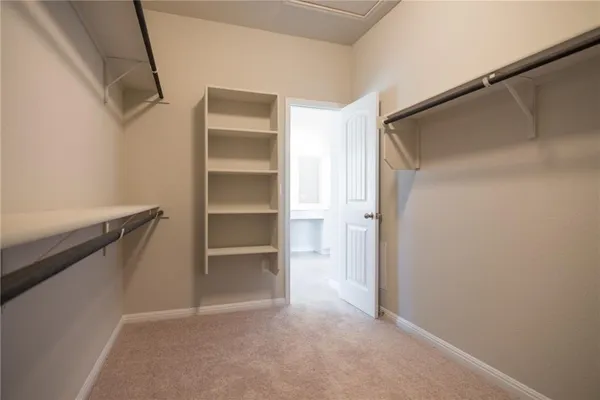a view of an empty walk in closet