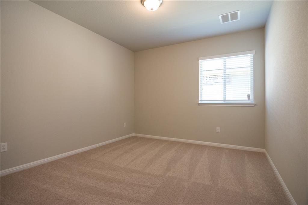 641 Schefer Street Leander, TX 78641 - Photo 13 of 17 Carpeted interior room featuring neutral wall finishes and a single window with blinds