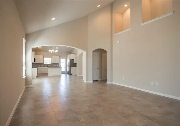 a view of a hallway with a living room