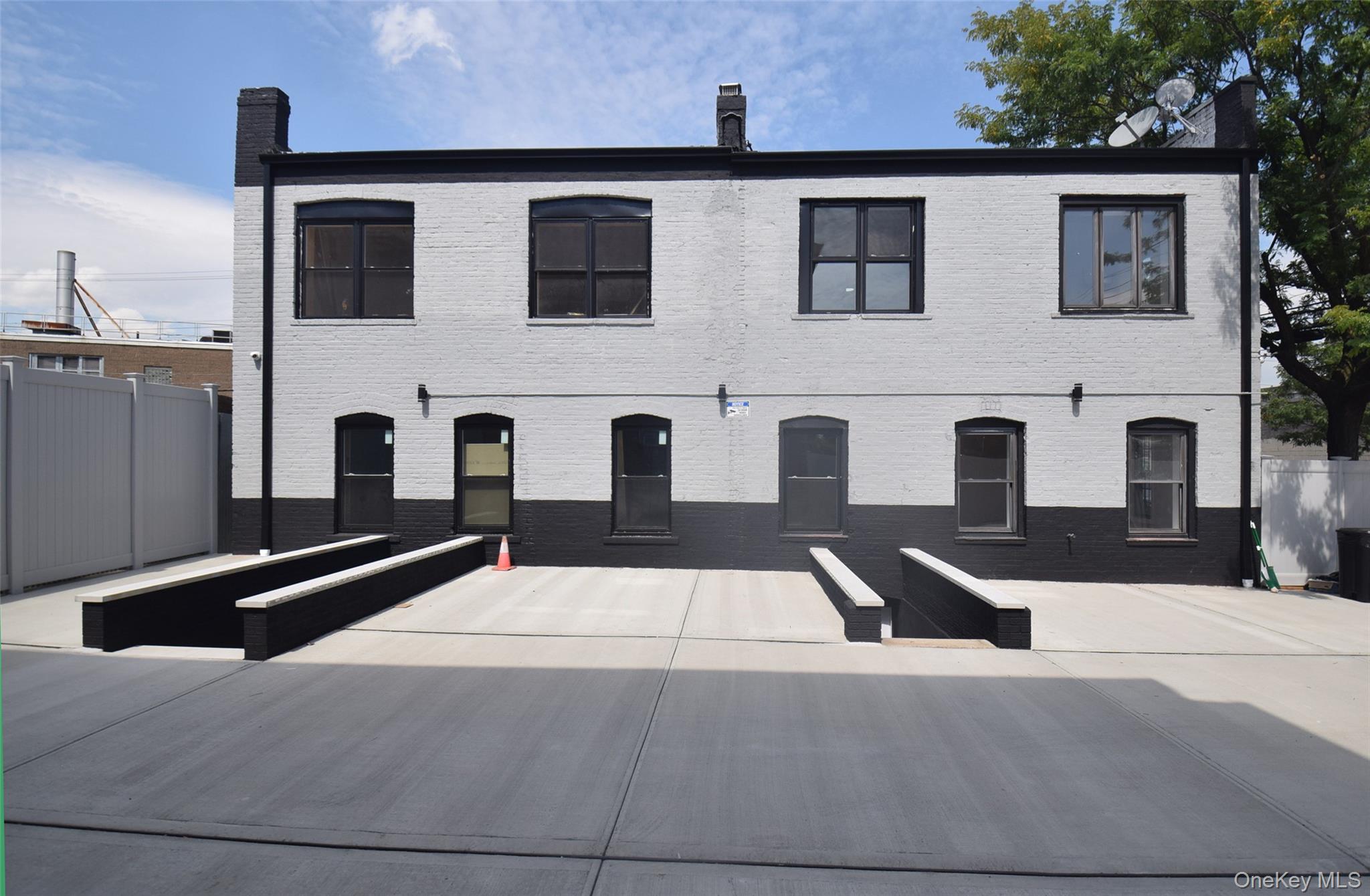 155-20 Tuskegee Airmen Way Queens, NY 11433 - Photo 11 of 13 a front view of building with yard