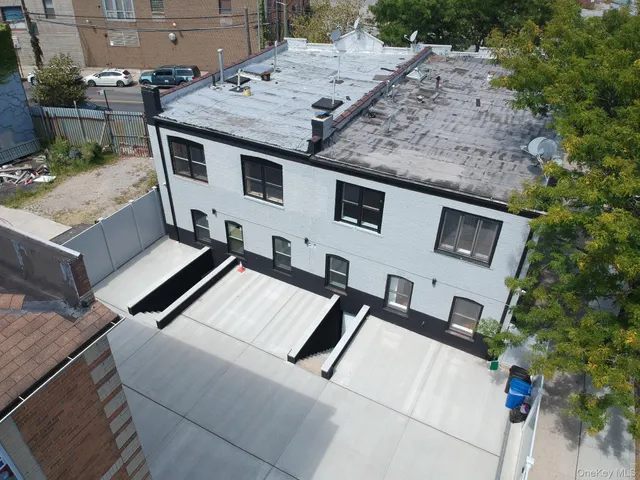 a aerial view of a house with a yard