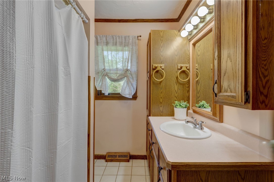 3385 West Western Reserve Road Canfield, OH 44406 - Photo 11 of 29 Bathroom with molding, tile flooring, and oversized vanity
