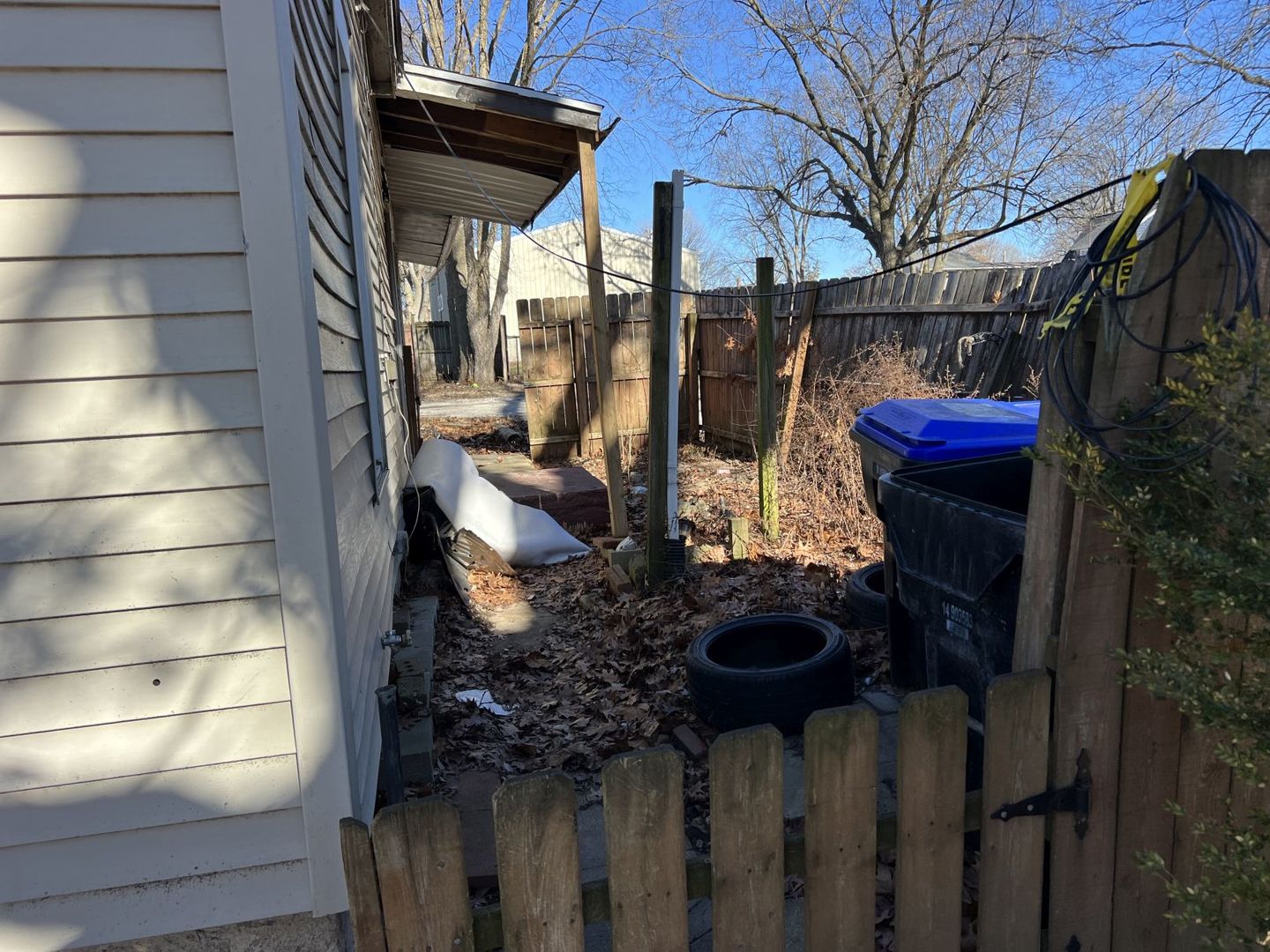 405 West Bissell Street Bloomington, IL 61701 - Photo 4 of 21 a view of a house with a small yard and a fireplace