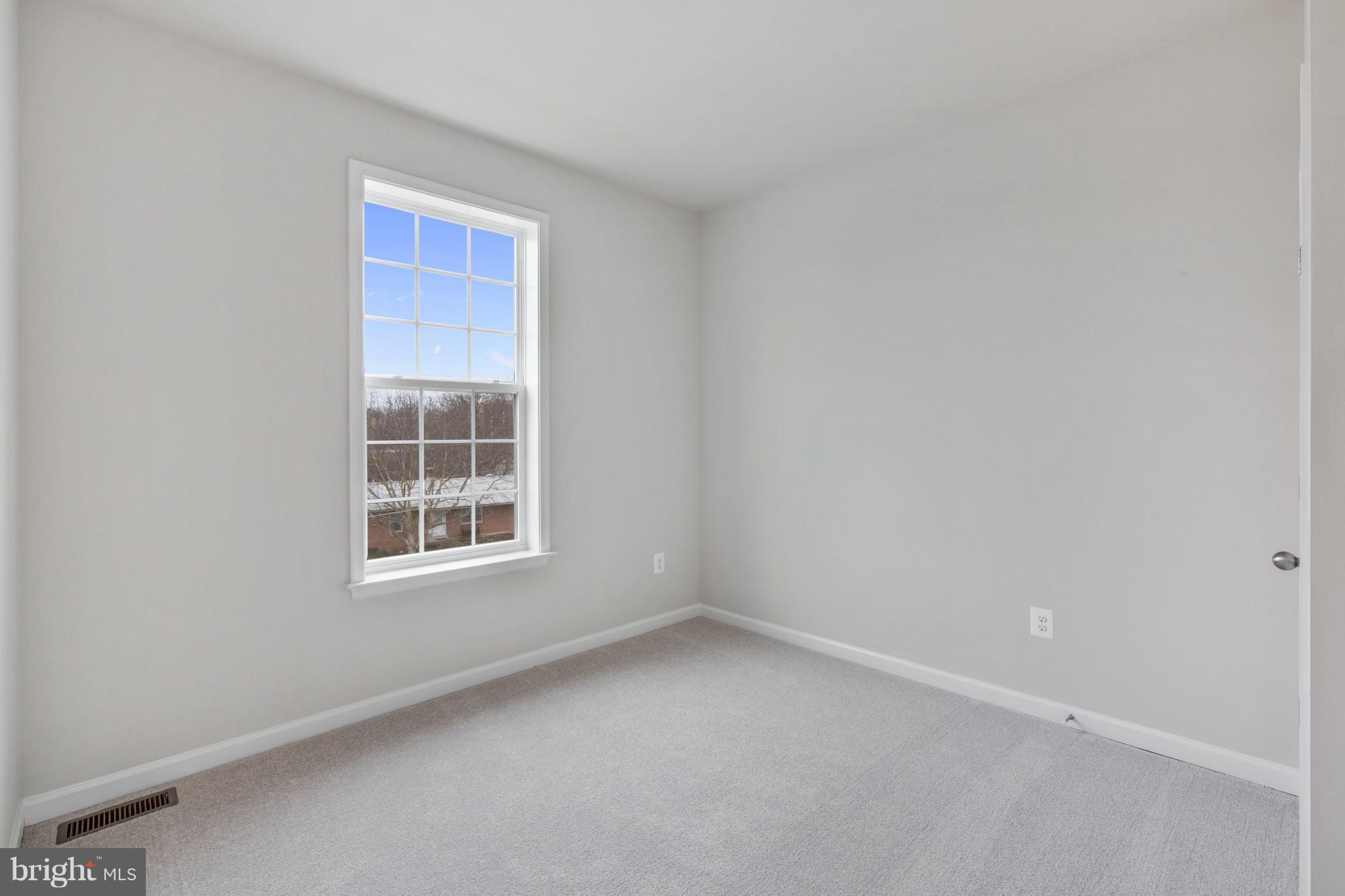 7875 Wormans Mill Road Frederick, MD 21701 - Photo 22 of 30 an empty room with a window