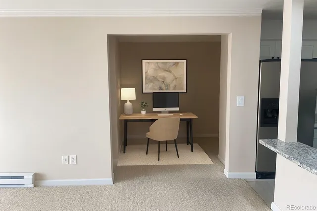 a workspace with furniture and a window