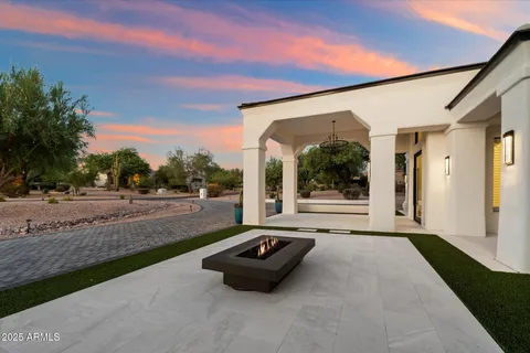 a view of house with outdoor space patio and mountain view