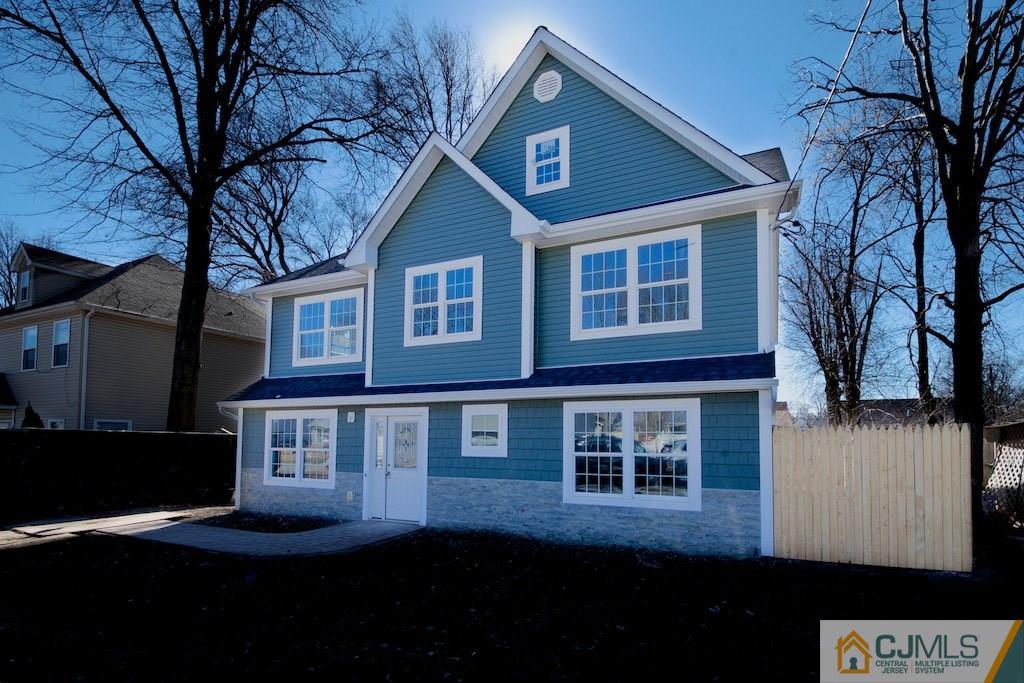 17 Parkerson Road Edison, NJ 08817 - Photo 1 of 1 a front view of a house with a yard