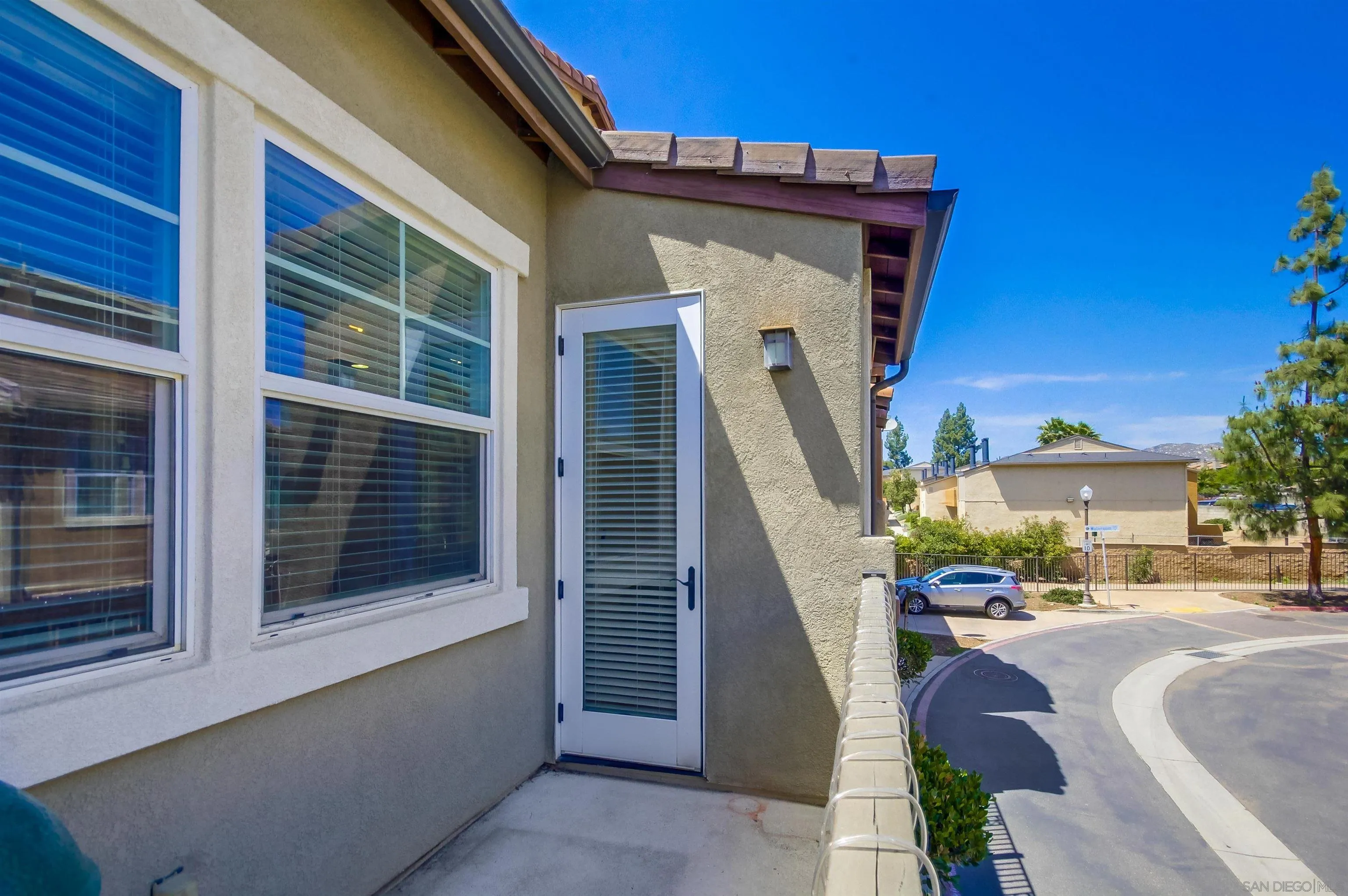 9810 Old Tree Lane Santee, CA 92071 - Photo 20 of 37 a front view of a house with outdoor space