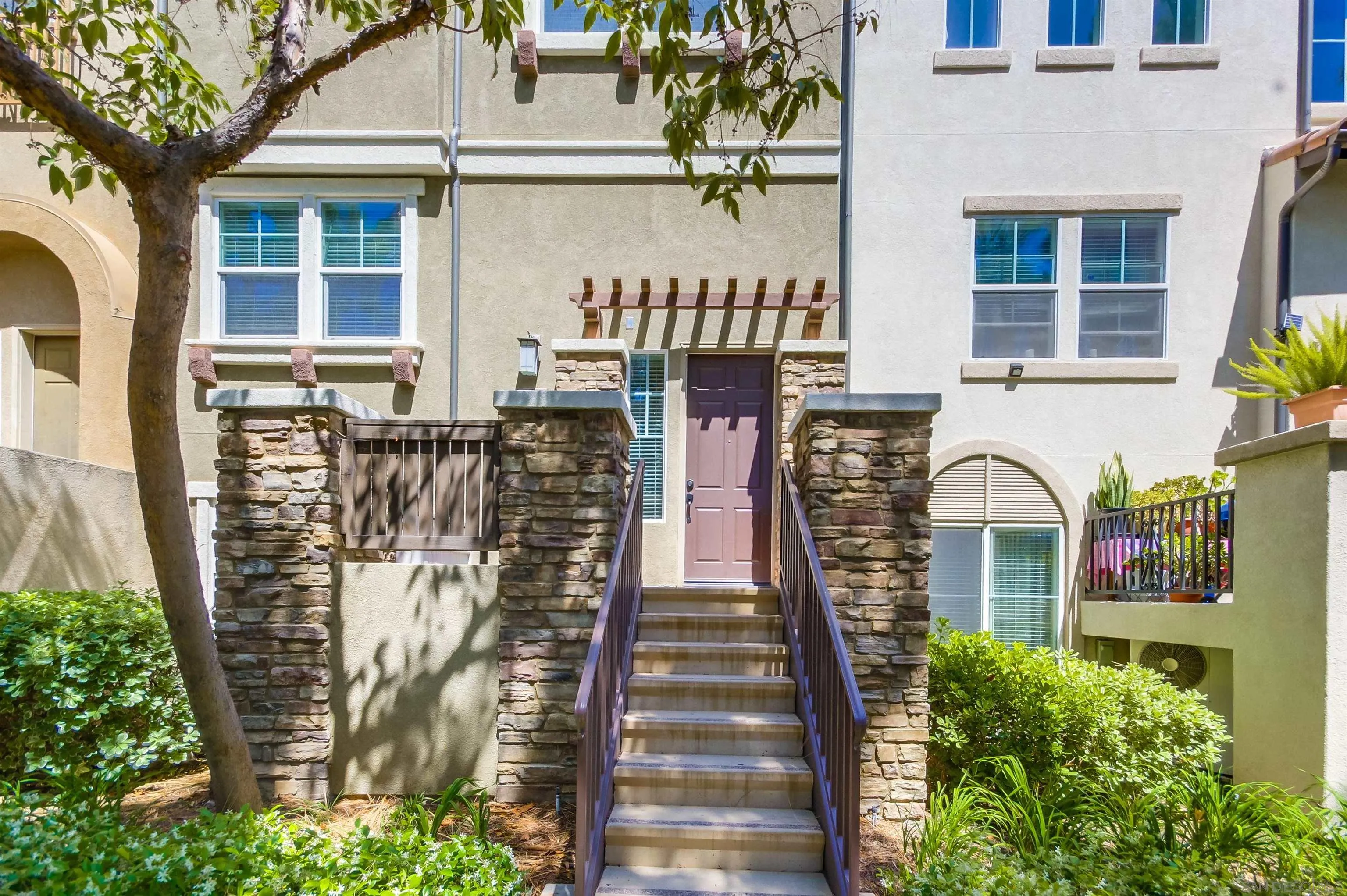 9810 Old Tree Lane Santee, CA 92071 - Photo 2 of 37 a front view of a house with large windows
