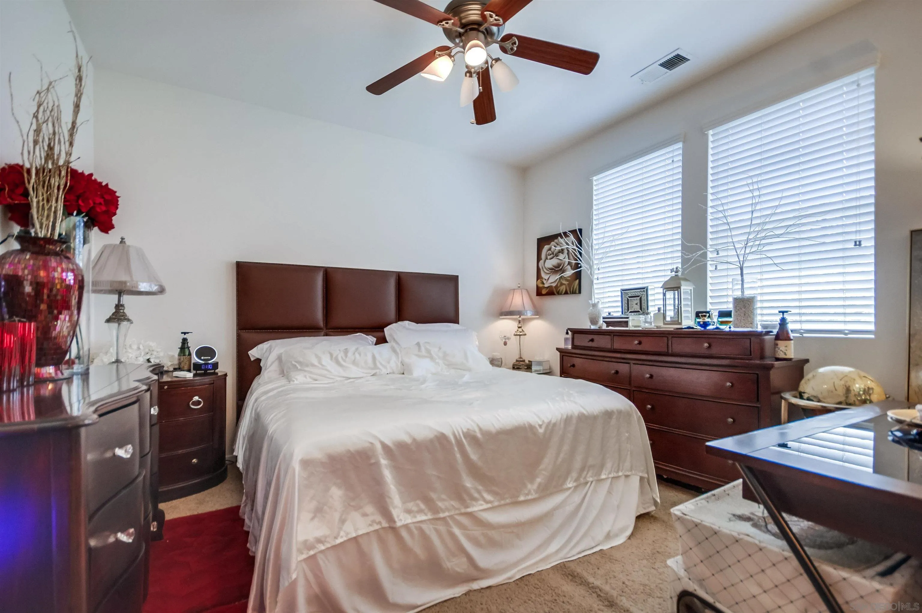 9810 Old Tree Lane Santee, CA 92071 - Photo 22 of 37 a bedroom with a bed and a chandelier