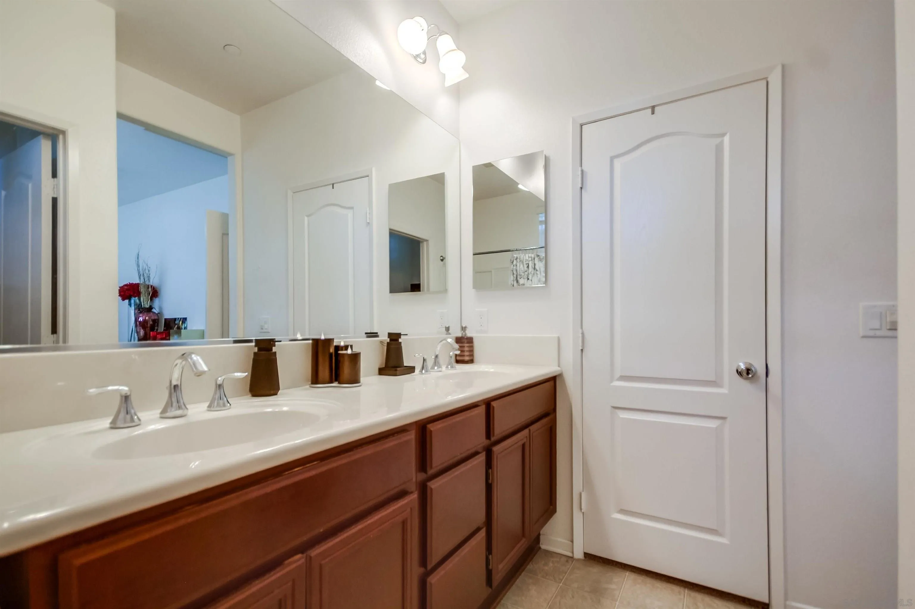 9810 Old Tree Lane Santee, CA 92071 - Photo 25 of 37 a bathroom with a double vanity sink and a mirror