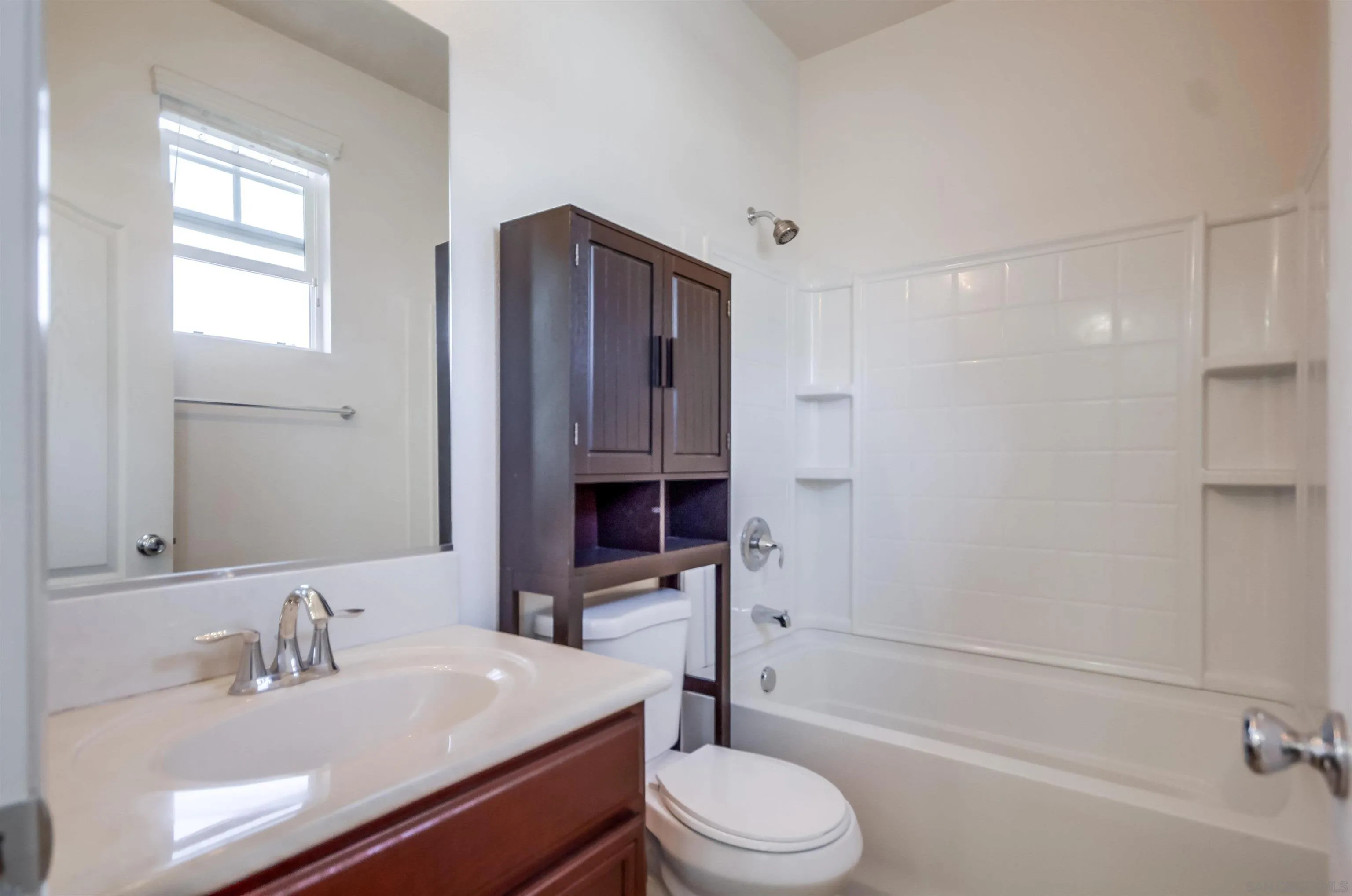 9810 Old Tree Lane Santee, CA 92071 - Photo 31 of 37 a bathroom with a sink a toilet and shower