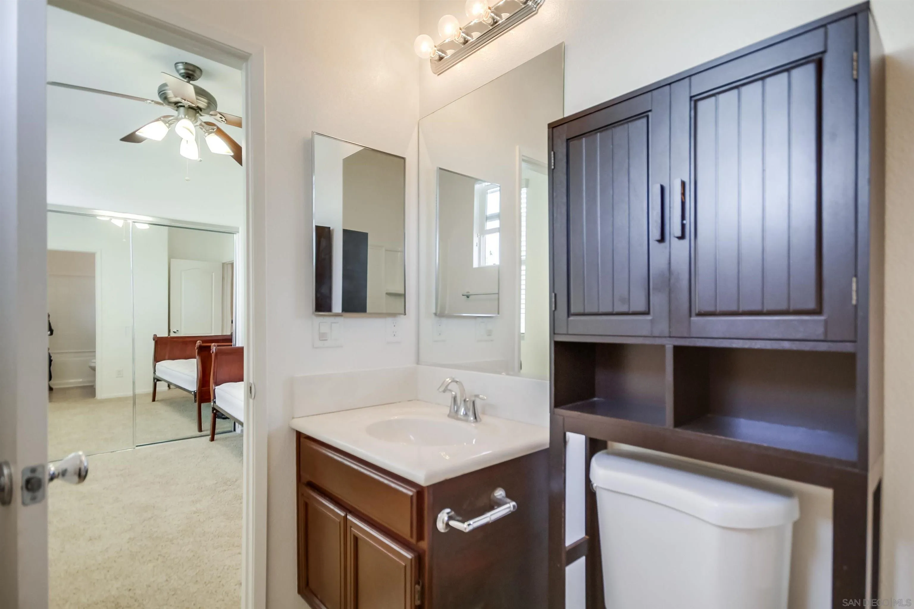 9810 Old Tree Lane Santee, CA 92071 - Photo 32 of 37 a kitchen with a sink cabinets and wooden floor