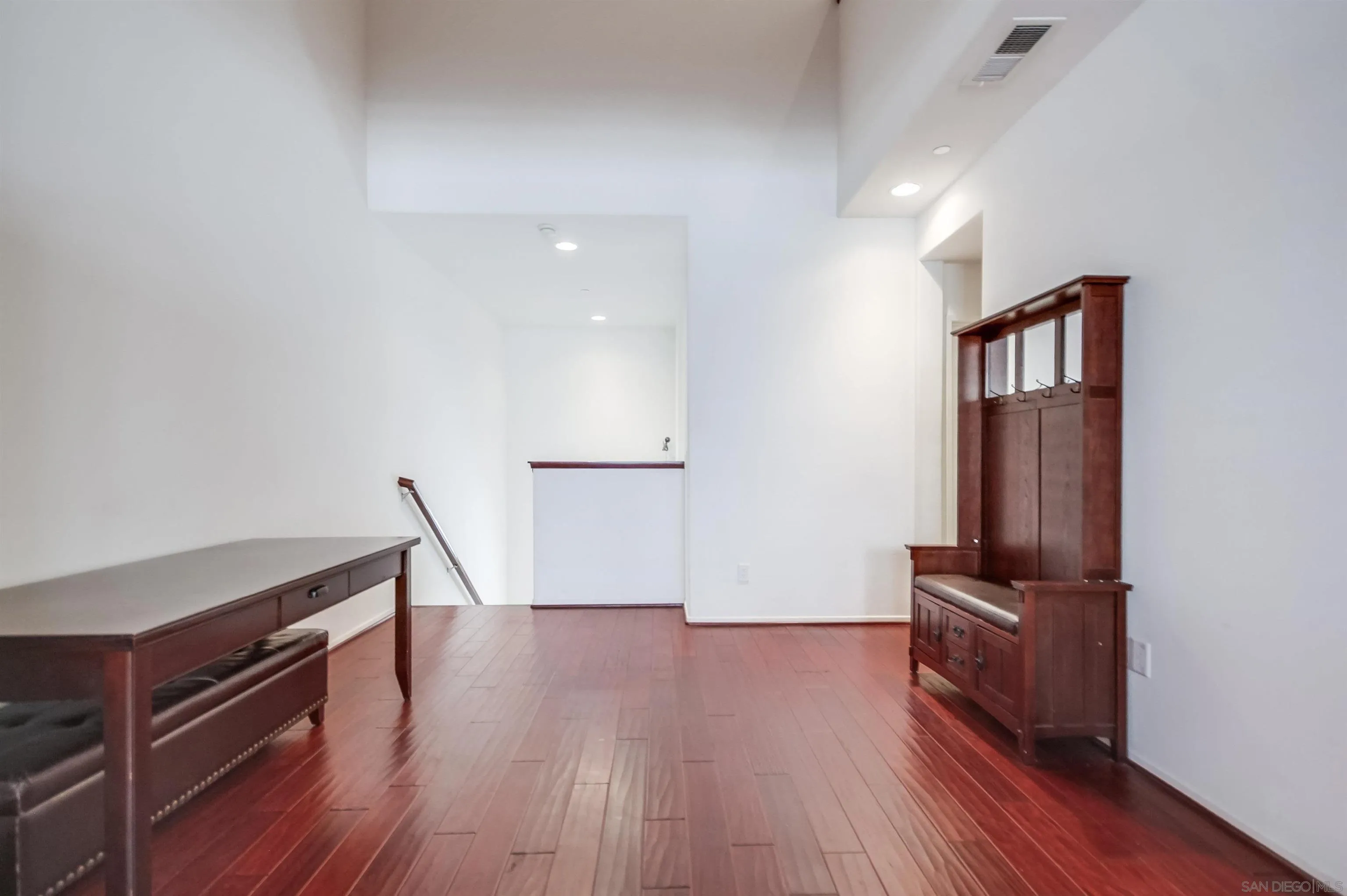 9810 Old Tree Lane Santee, CA 92071 - Photo 6 of 37 a view of a hallway with wooden floor