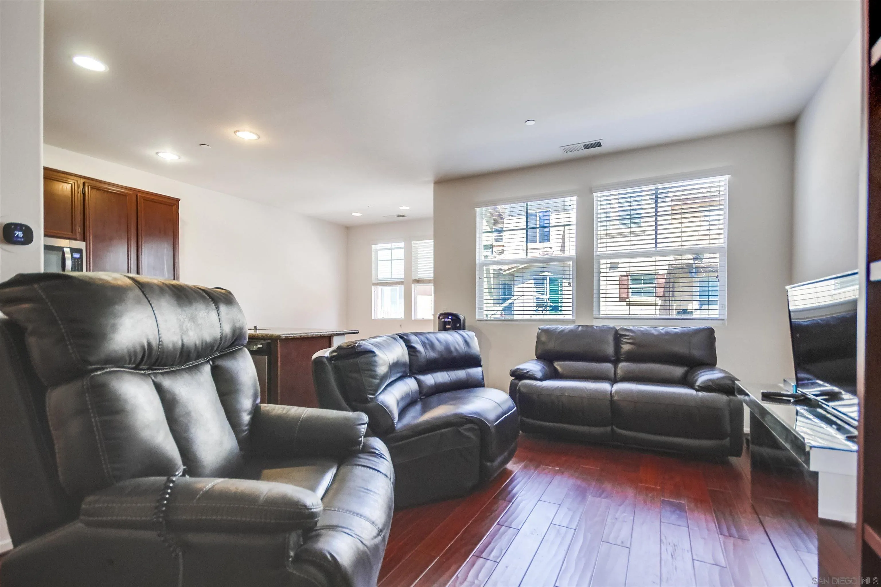 9810 Old Tree Lane Santee, CA 92071 - Photo 10 of 37 a living room with furniture and a flat screen tv