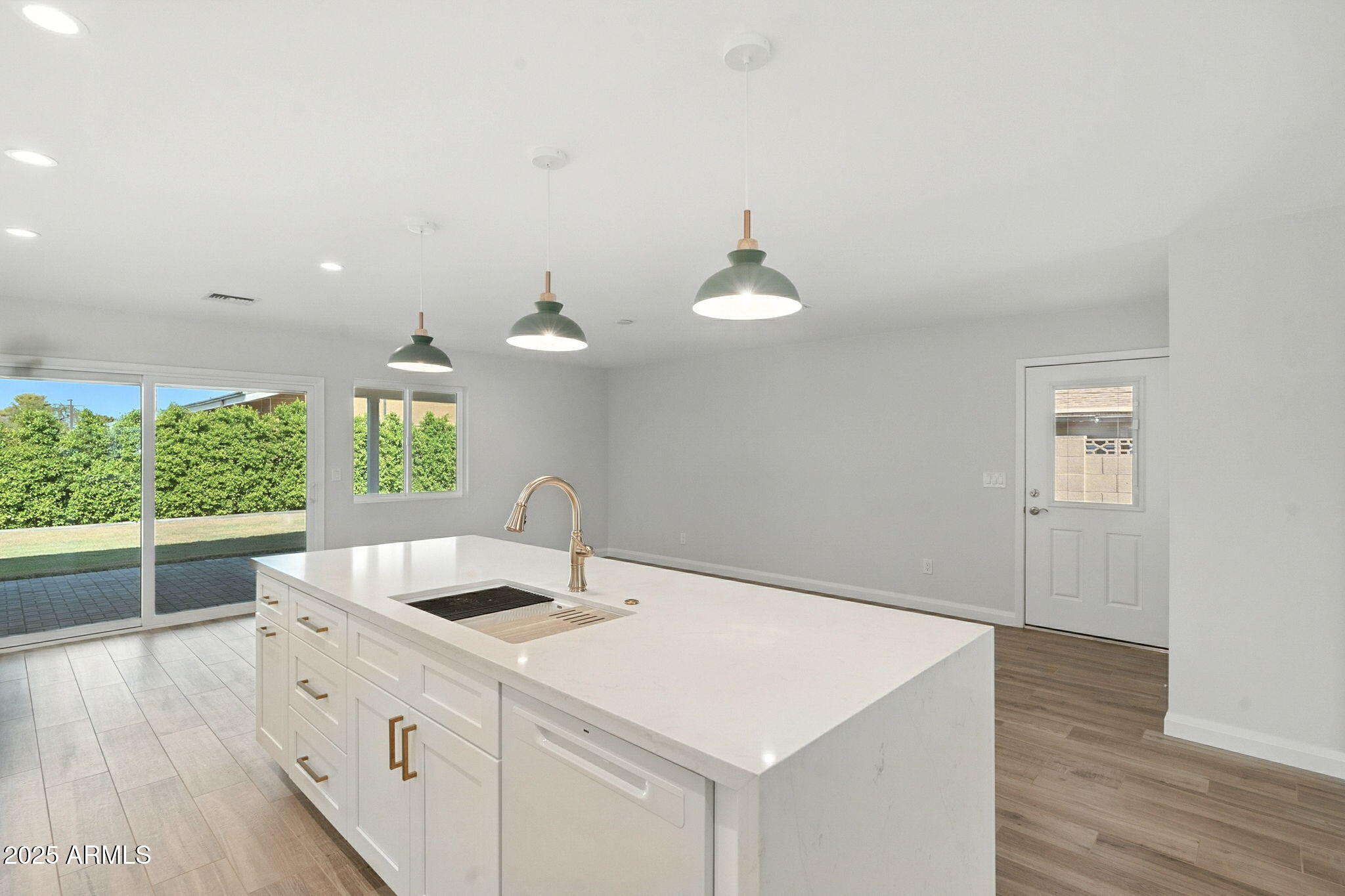 2814 North 51st Street Phoenix, AZ 85008 - Photo 15 of 50 a kitchen with a sink and wooden floor