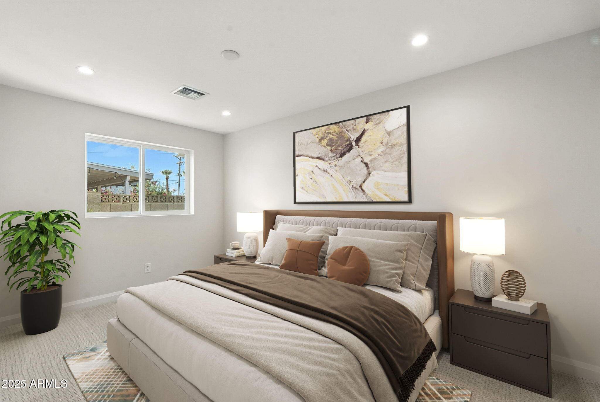2814 North 51st Street Phoenix, AZ 85008 - Photo 23 of 50 a bedroom with a large bed and a potted plant