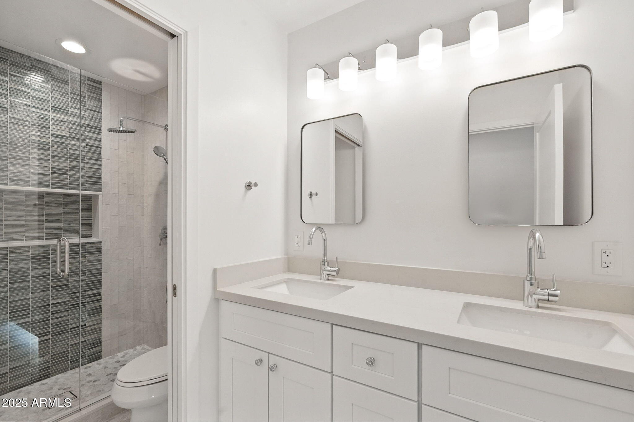 2814 North 51st Street Phoenix, AZ 85008 - Photo 29 of 50 a bathroom with a double vanity sink toilet and shower