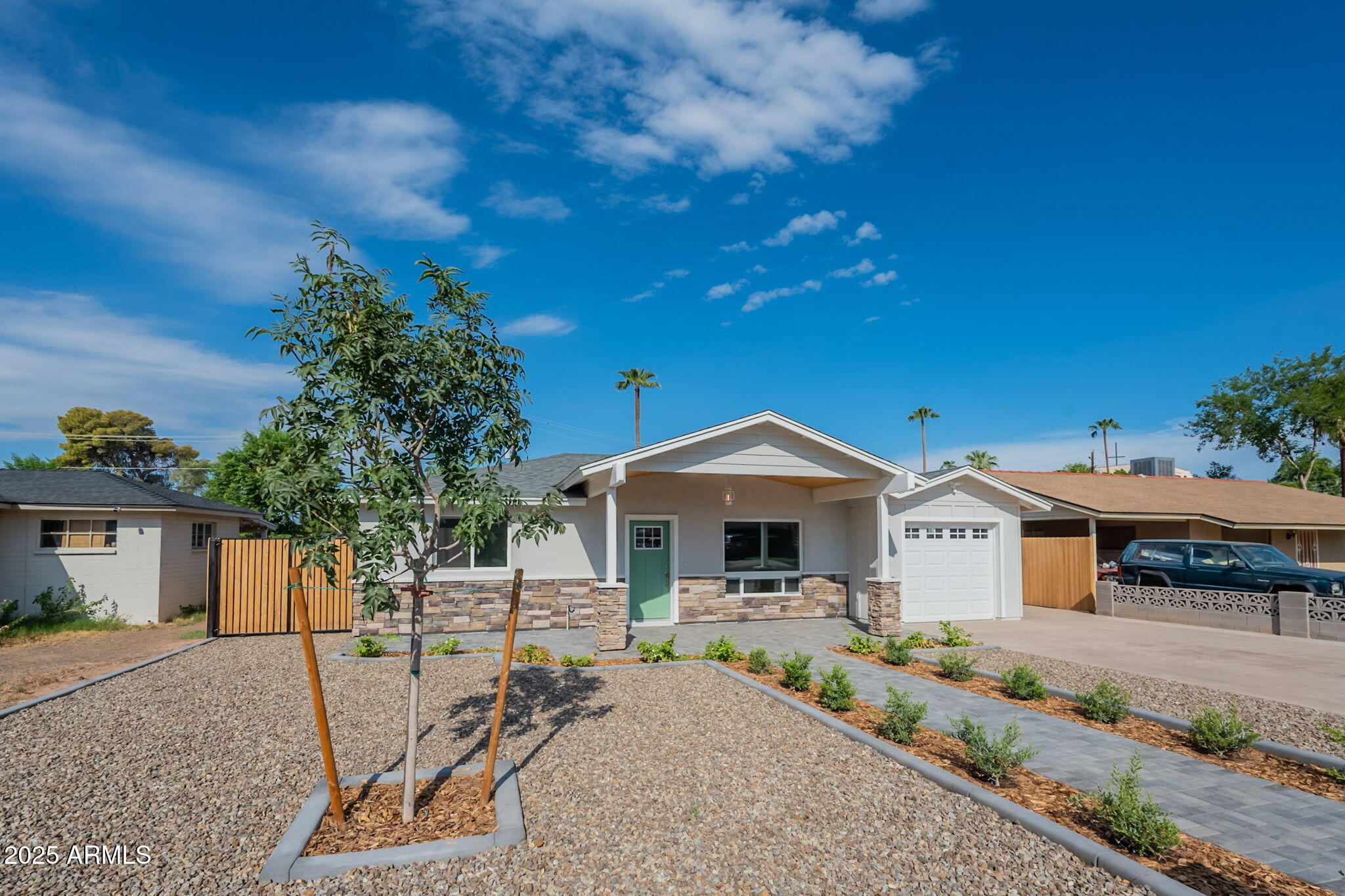 2814 North 51st Street Phoenix, AZ 85008 - Photo 2 of 50 a front view of a house with garden