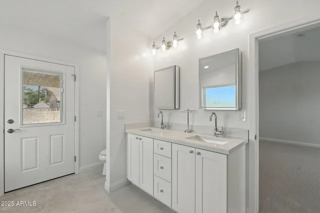 a white bath tub sitting next to a white toilet