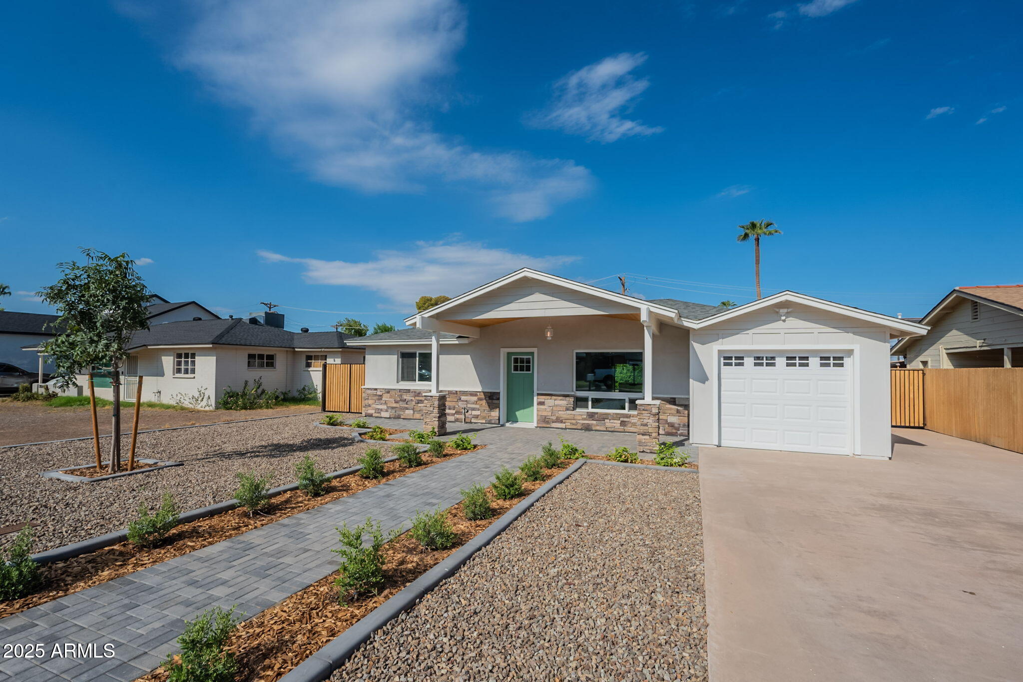 2814 North 51st Street Phoenix, AZ 85008 - Photo 3 of 50 a front view of a house with a yard