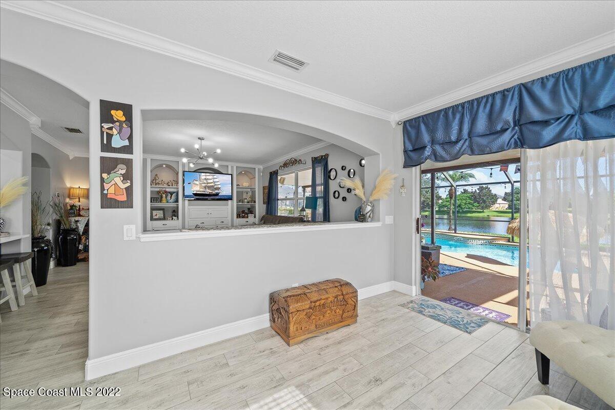 4225 Fenrose Circle Melbourne, FL 32940 - Photo 14 of 49 a bedroom with a large bed and a window