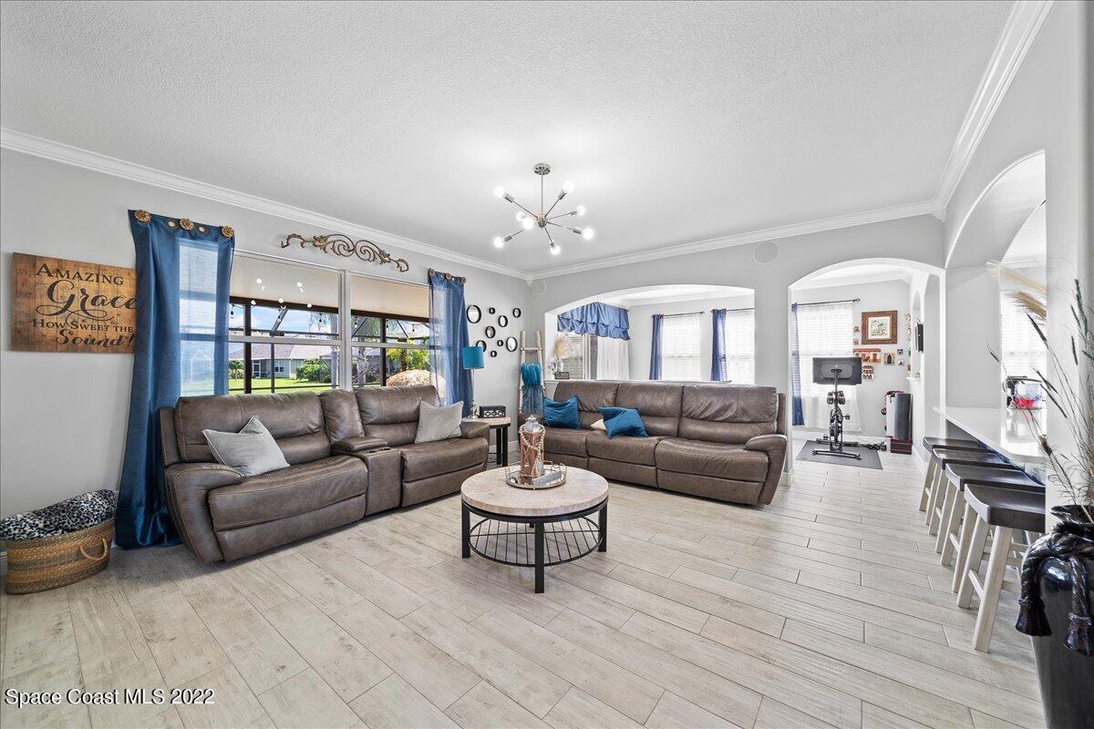 4225 Fenrose Circle Melbourne, FL 32940 - Photo 17 of 49 a living room with furniture and a large window