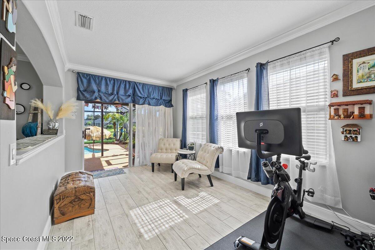 4225 Fenrose Circle Melbourne, FL 32940 - Photo 18 of 49 a living room with furniture and a flat screen tv