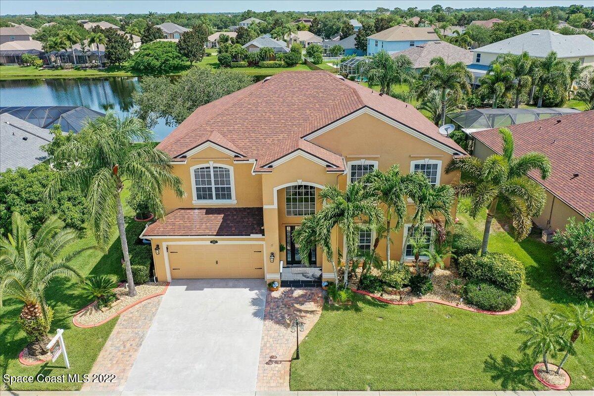 4225 Fenrose Circle Melbourne, FL 32940 - Photo 2 of 49 an aerial view of a house with a yard