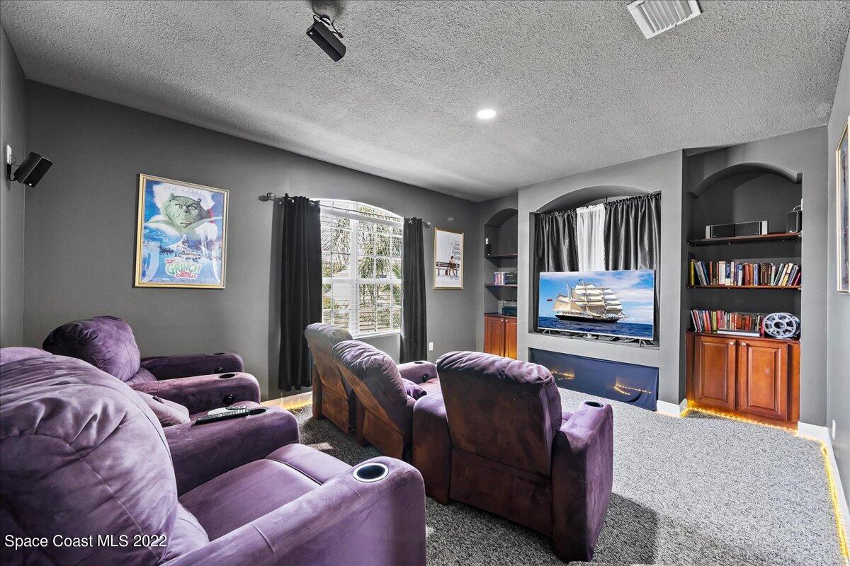 4225 Fenrose Circle Melbourne, FL 32940 - Photo 23 of 49 a living room with furniture and a window