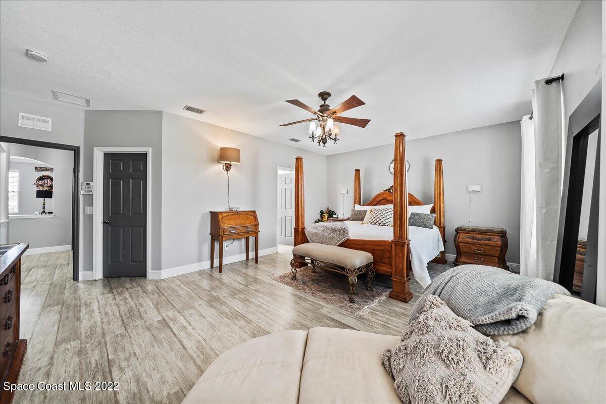 4225 Fenrose Circle Melbourne, FL 32940 - Photo 26 of 49 a living room with furniture and a large window
