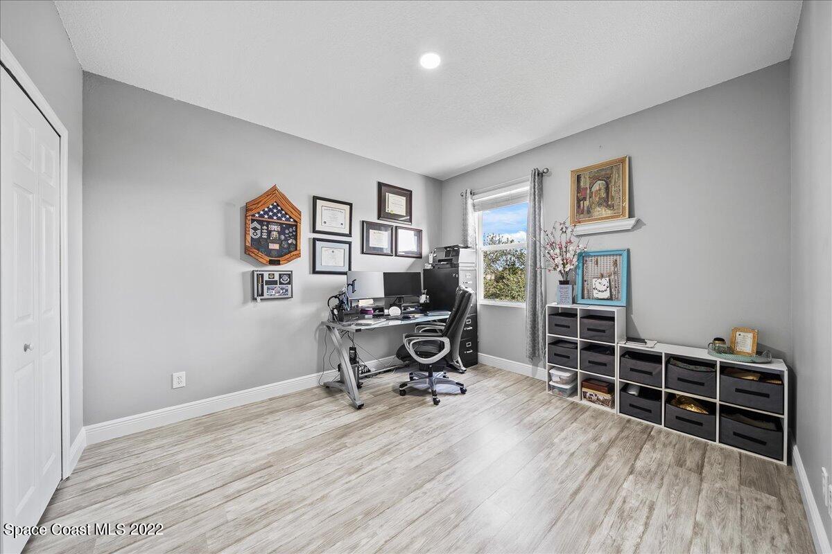 4225 Fenrose Circle Melbourne, FL 32940 - Photo 31 of 49 a view of a workspace with furniture and wooden floor