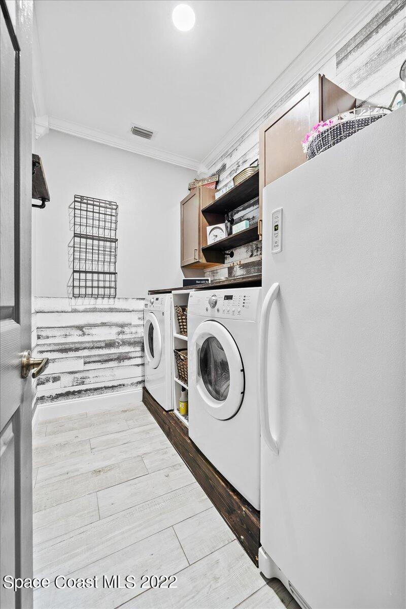 4225 Fenrose Circle Melbourne, FL 32940 - Photo 34 of 49 a utility room with dryer and washer