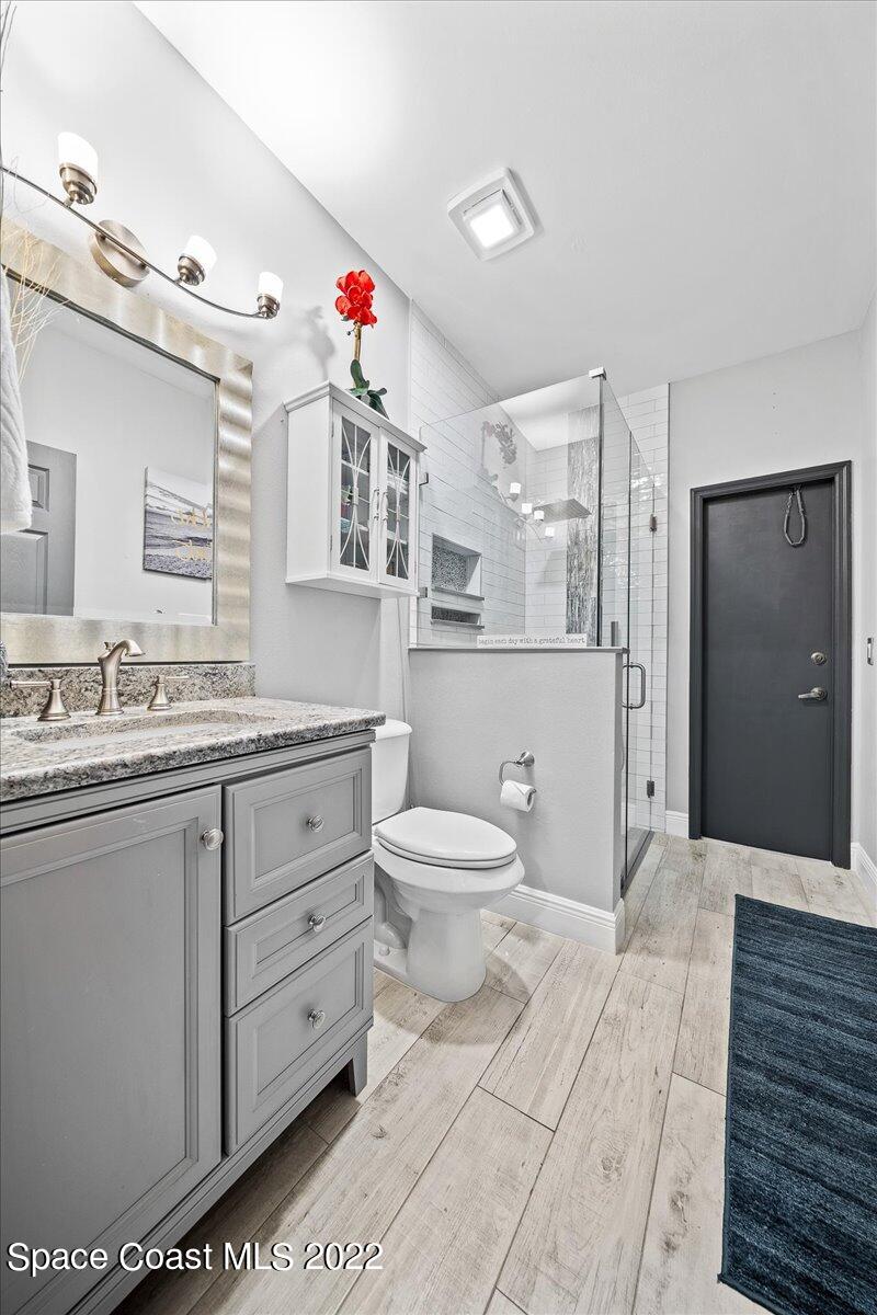 4225 Fenrose Circle Melbourne, FL 32940 - Photo 35 of 49 a bathroom with a sink a toilet and shower