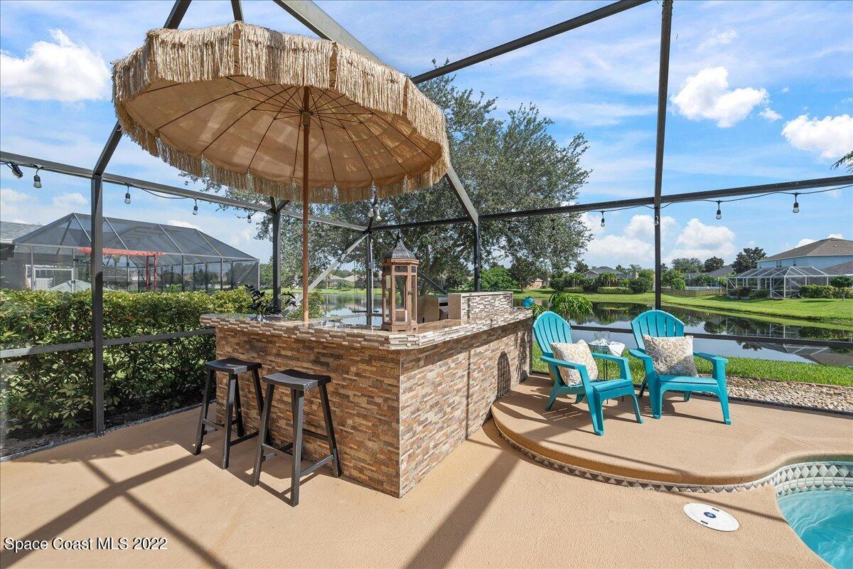 4225 Fenrose Circle Melbourne, FL 32940 - Photo 40 of 49 a view of a swimming pool with a patio