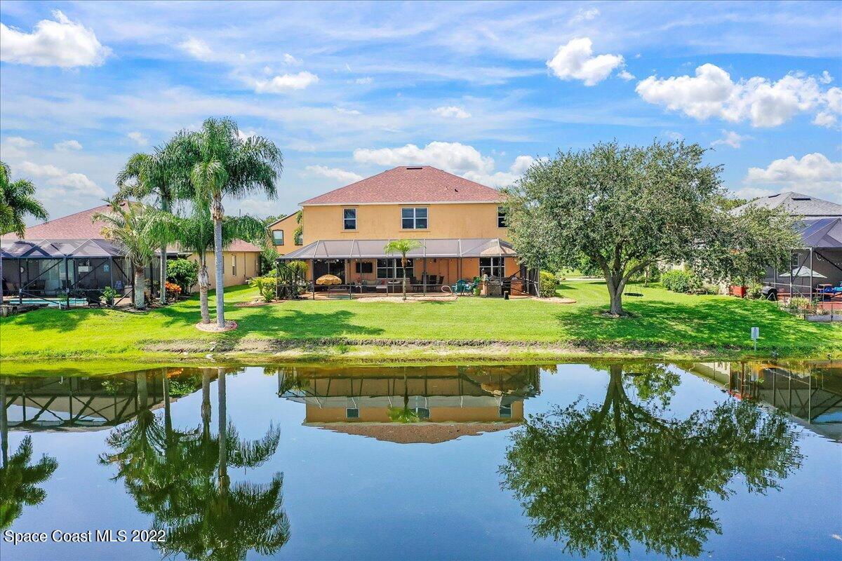 4225 Fenrose Circle Melbourne, FL 32940 - Photo 43 of 49 a view of a house with a yard and swimming pool