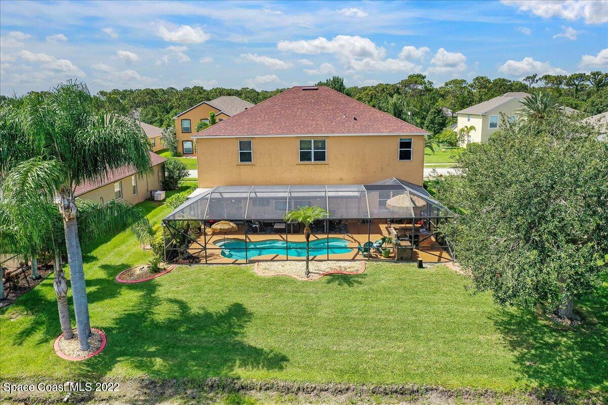 4225 Fenrose Circle Melbourne, FL 32940 - Photo 44 of 49 an aerial view of a house with swimming pool yard and outdoor seating