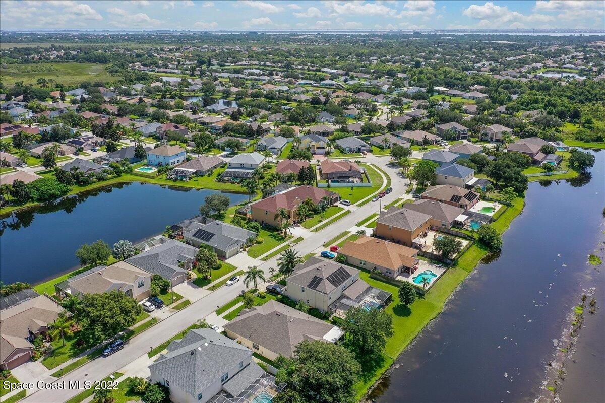 4225 Fenrose Circle Melbourne, FL 32940 - Photo 47 of 49 an aerial view of a city with lots of residential buildings
