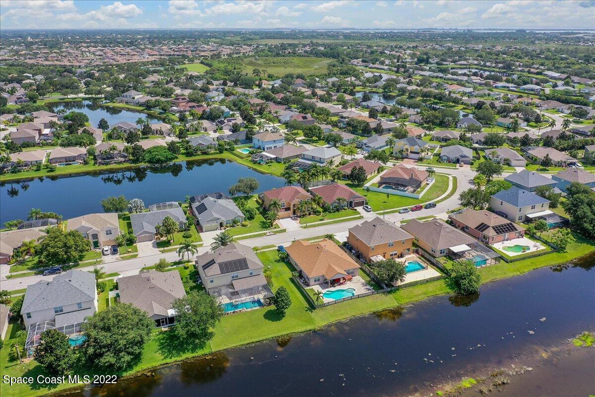 4225 Fenrose Circle Melbourne, FL 32940 - Photo 48 of 49 an aerial view of residential houses with outdoor space and parking