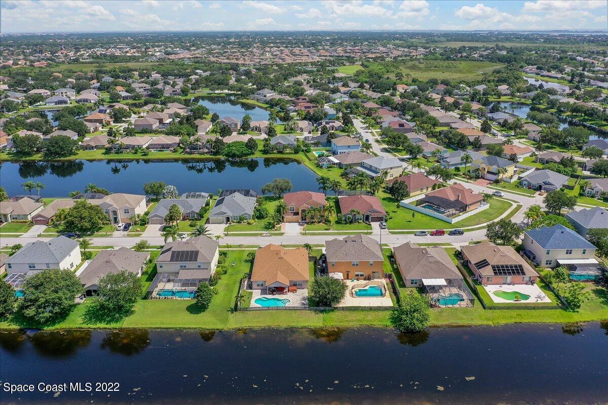 4225 Fenrose Circle Melbourne, FL 32940 - Photo 49 of 49 an aerial view of residential houses with outdoor space
