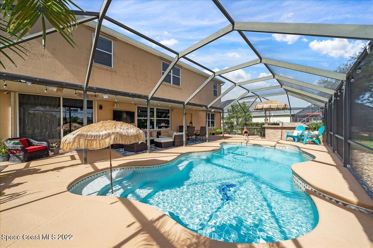 4225 Fenrose Circle Melbourne, FL 32940 - Photo 5 of 49 a view of a swimming pool with a patio