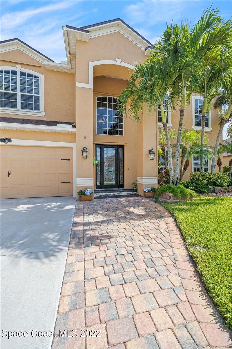 4225 Fenrose Circle Melbourne, FL 32940 - Photo 6 of 49 a front view of a house with a yard