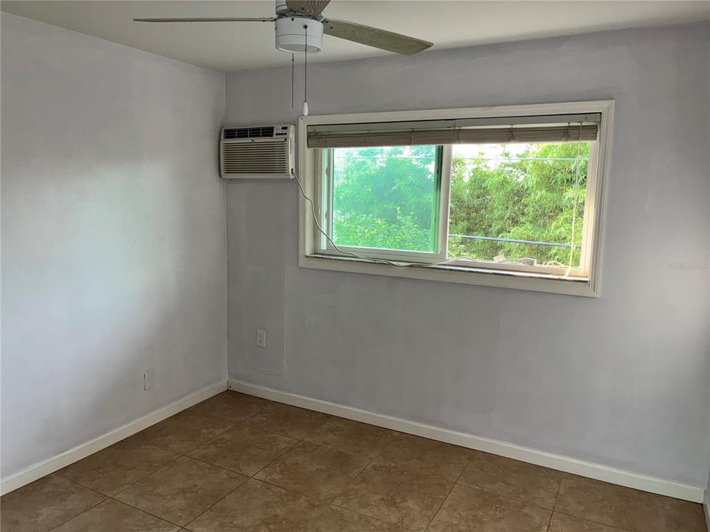 3101 Bee Ridge Road, Unit 214 Sarasota, FL 34239 - Photo 5 of 9 an empty room with a window