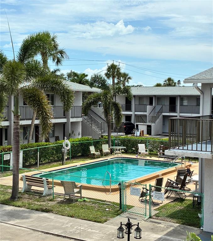3101 Bee Ridge Road, Unit 214 Sarasota, FL 34239 - Photo 8 of 9 a view of a house with a yard
